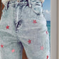 Distressed Star Jeans with pink star detailing and pockets, perfect for a playful and unique look. Made of 65% cotton and 35% polyester.