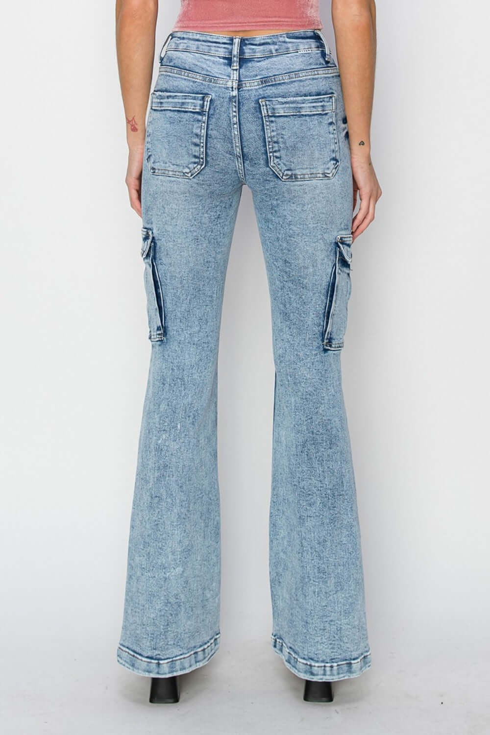 High rise cargo flare jeans with utility pockets and retro style, showcasing a flattering high-waisted design from the back.