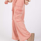 Woman wearing Knit Terry Mineral Wash Wide Leg Pants in pink, showcasing wide-leg fit and trendy mineral wash design.