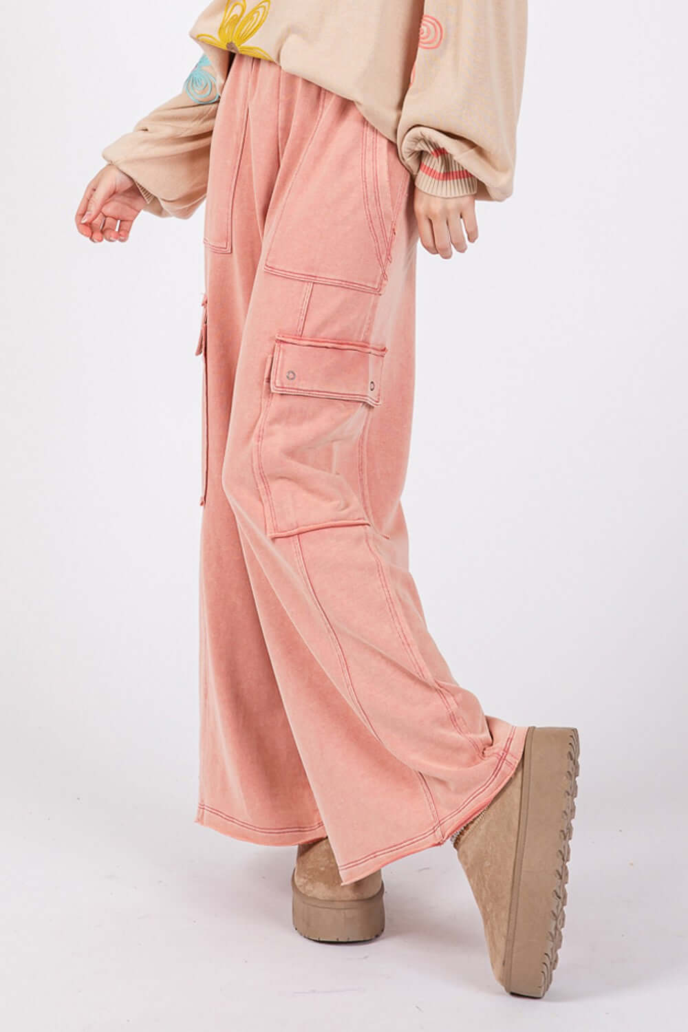 Woman wearing Knit Terry Mineral Wash Wide Leg Pants in pink, showcasing wide-leg fit and trendy mineral wash design.