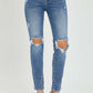 High Rise Knee Distressed Skinny Jeans by Risen Jeans featuring trendy knee rips and flattering high-rise waist. Perfect for any chic outfit!