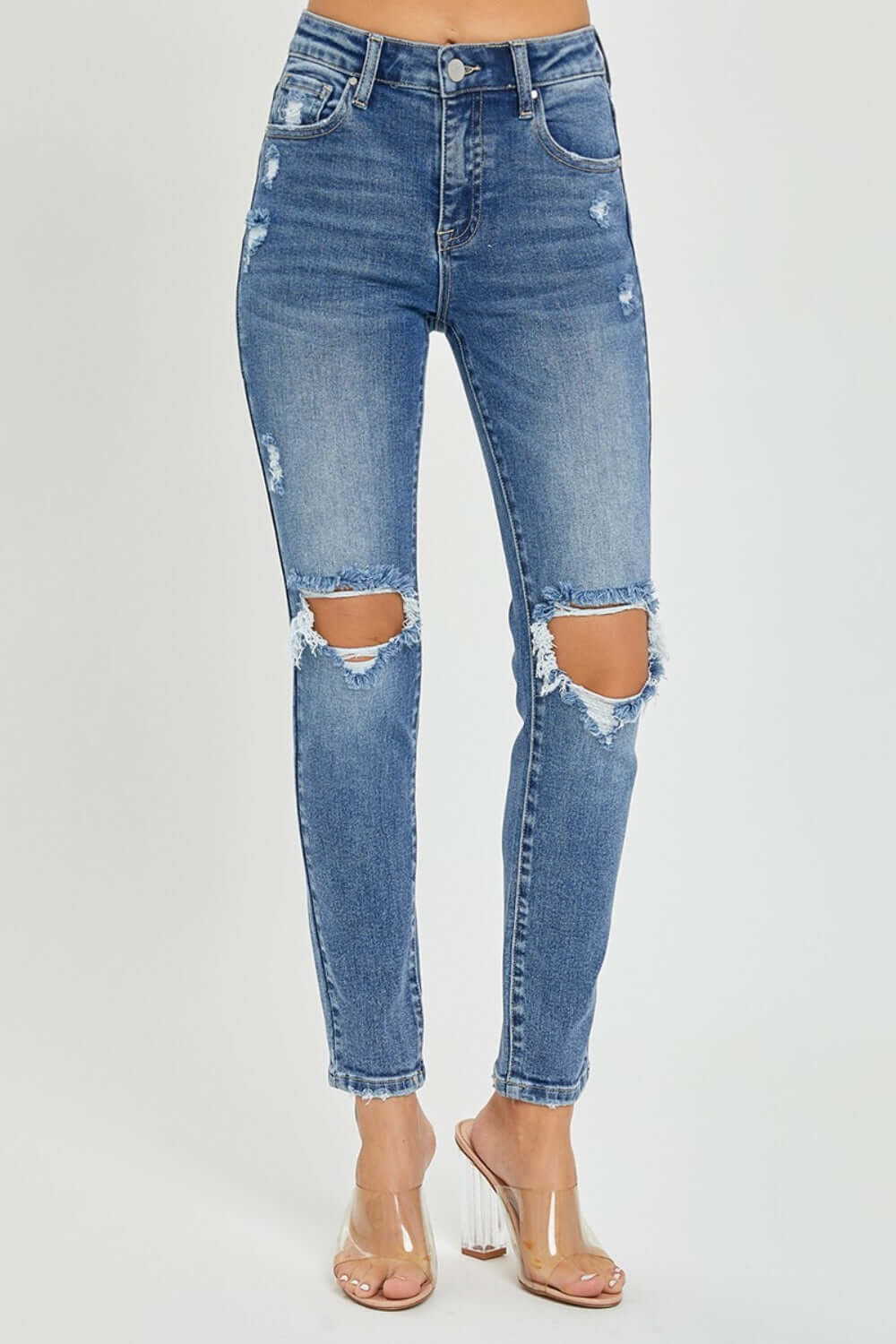 High Rise Knee Distressed Skinny Jeans by Risen Jeans featuring trendy knee rips and flattering high-rise waist. Perfect for any chic outfit!