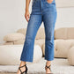 Woman wearing Mini Mia Full Size Tummy Control High Waist Jeans from RFM Jeans, showing a comfortable and flattering fit, enhancing her silhouette.