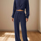 Bella Road Crisscross Round Neck Top and Drawstring Pants Set in navy blue, perfect for casual outings and date nights.