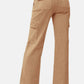 High rise wide leg cargo jeans with pockets, showcasing a trendy and comfortable fit for casual style.