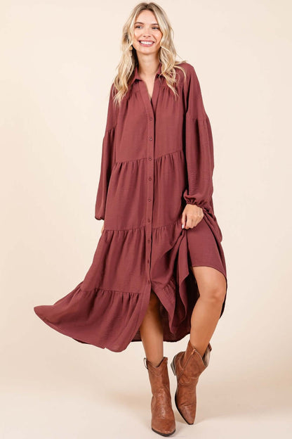 Woman in Mittoshop Tiered Button Down Long Sleeve Midi Dress with boots, showcasing elegant tiered design and stylish silhouette.