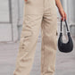 Woman wearing Baeful Long Straight Leg Jeans with Pockets, holding a black handbag, trendy casual chic outfit for all-day comfort