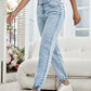 Woman wearing Bella Road High Waist Jeans with pockets and white sneakers in a stylish living room setting