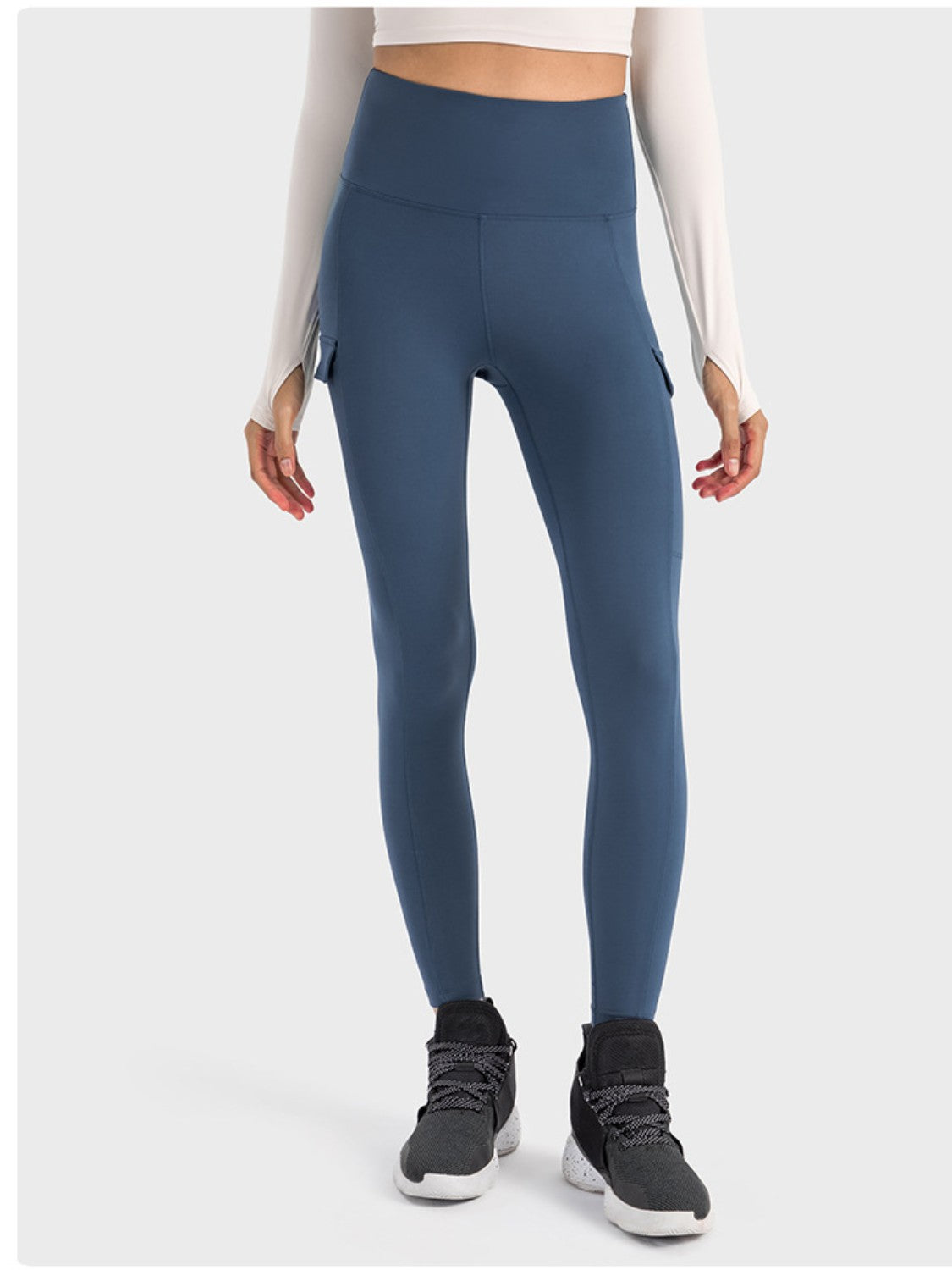 Millennia wide waistband sports leggings in blue, featuring pockets and a stylish fit for active lifestyles.