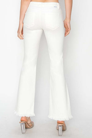 Back view of white crop flare step hem pants with raw hem and pockets, showcasing tummy control feature and stylish design.