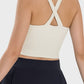 Stylish back view of Millennia Crisscross Grecian Neck Active Cami showcasing a unique crisscross design.