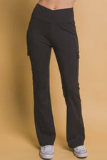 Black flared cargo leggings featuring a high waist and practical pockets, perfect for stylish everyday wear.