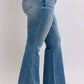 Side view of Judy Blue Mid Rise Tummy Control Vintage Wash Jeans, showcasing a flattering fit and retro style.