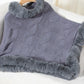 Cozy Bella Road Fuzzy Hem Cable-Knit Poncho in grey, featuring a stylish fuzzy trim for warmth on chilly days.