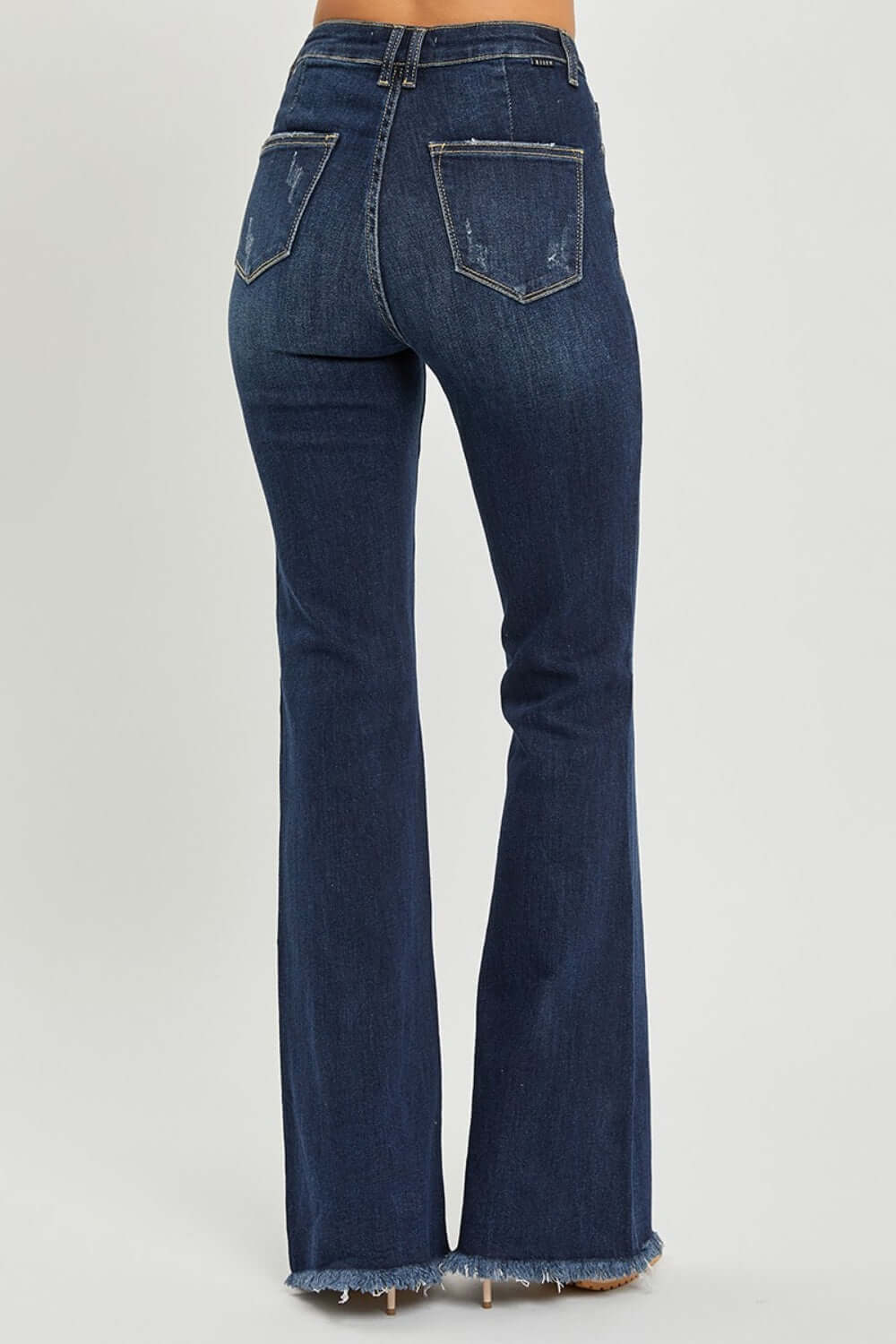 High Waist Raw Hem Flare Risen Jeans showcasing a flattering back view, with edgy raw hem detailing for a unique, retro-inspired look.