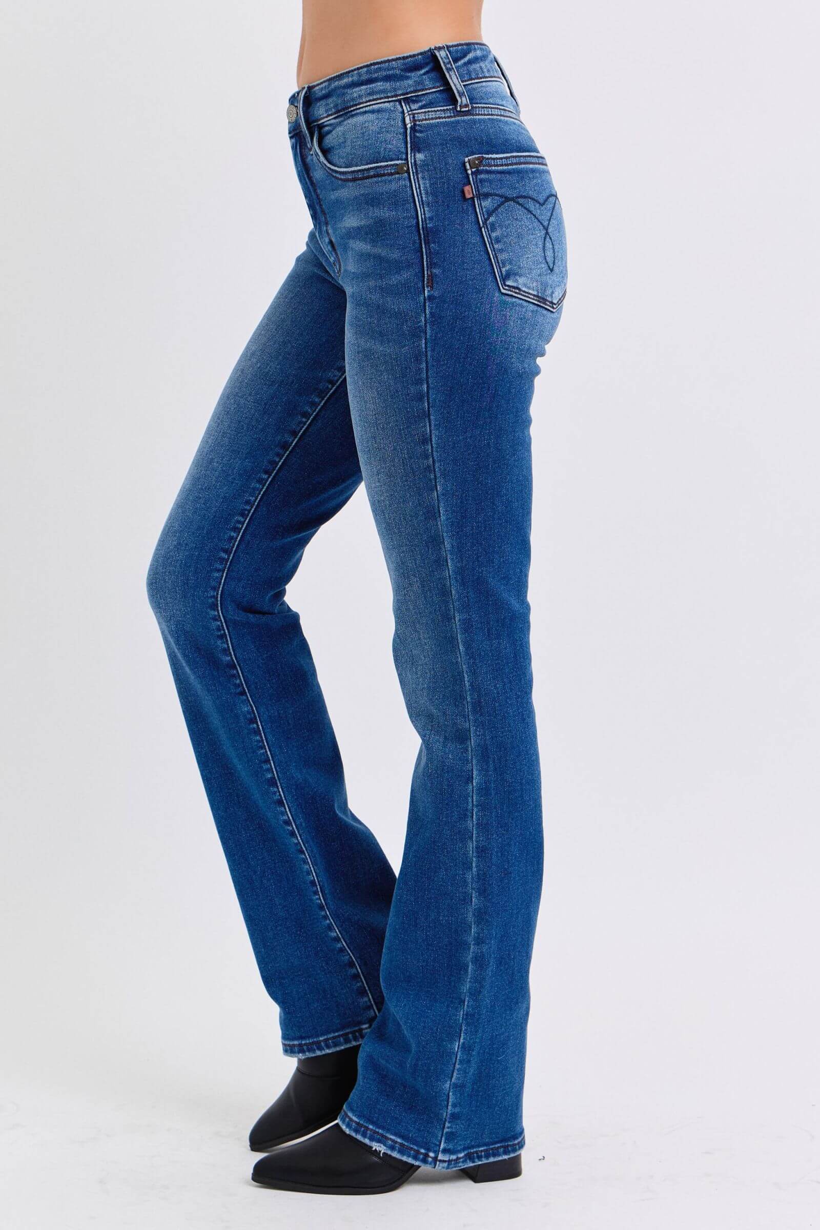 Judy Blue mid-rise bootcut jeans with thermal lining, featuring a flattering silhouette and slight flare at the hem.