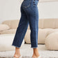 Woman wearing Tummy Control High Waist Raw Hem Distressed Jeans with heels, showing the stylish and slimming fit of RFM Jeans.