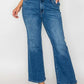 Woman wearing bytos Cat's Whiskers mid rise ankle jeans, showcasing a trendy and stylish denim look.