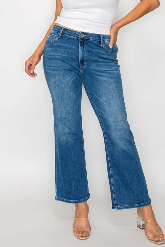 Woman wearing bytos Cat's Whiskers mid rise ankle jeans, showcasing a trendy and stylish denim look.