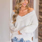 Cozy Bella Road sweater with frayed hem and dropped shoulders, adding playful charm and style to casual outfits.