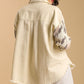 Back view of Umgee Plus Size Distressed Button Up Jacket showcasing raw hem and trendy animal print sleeves.