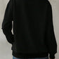 Back view of Bella Road Yellowstone Round Neck Long Sleeve Sweatshirt in black, showcasing cozy style and comfortable fit.