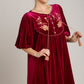 Stunning Umgee embroidered velvet mini dress in wine red with tassels, perfect for elegant occasions and special events.