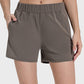 Millennia Elastic Waist Active Shorts in gray, featuring a comfortable stretch and side pockets for active lifestyles.