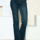 Denim straight jeans with button fly and distressed hem for a trendy look