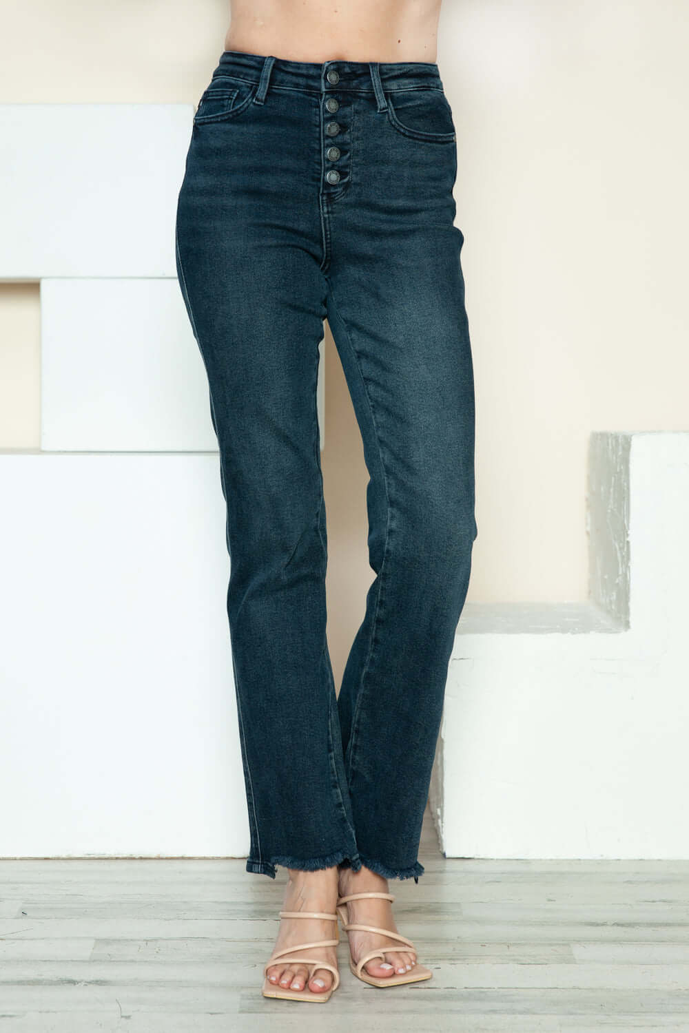 Denim straight jeans with button fly and distressed hem for a trendy look