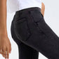 Slim fit of black pocketed stretch bootcut jeans paired with a casual white top, showcasing stylish comfort.