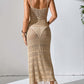 Back view of woman wearing a beige Openwork Scoop Neck Cover-Up Dress with tassels and intricate patterns