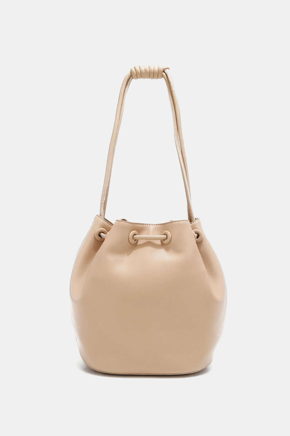 Nicole Lee USA Amy Studded Bucket Bag in beige vegan leather with drawstring closure and metal feet.