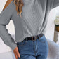 Cozy Bella Road cable-knit turtleneck cold shoulder sweater in gray, paired with jeans for a chic and playful chilly day look.