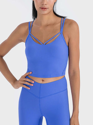 Model wearing blue Millennia Double Strap Ribbed Sports Cami, showcasing sporty elegance and comfort for workouts.