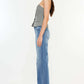 Side view of a woman wearing Ultra High Rise Cat's Whiskers Jeans with a high-waisted silhouette and vintage detailing.