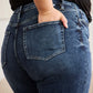 Close-up of model wearing Tummy Control High Waist Raw Hem Distressed Jeans | Petite - RFM Jeans