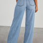 Raw hem wide leg jeans with pockets, back view. Bella Road denim with no stretch, made from 65% cotton and 35% polyester.