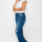 Woman modeling bytos Full Size High Rise Bootcut Jeans with Pockets, showcasing style and comfort.