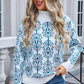 Woman wearing Angel Wings Flower Turtleneck Sweater, featuring blue floral design, perfect for stylish winter outfits.