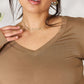 Woman wearing luxurious rayon long sleeve V-neck top in brown color, designed for warmth and versatility.