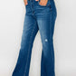 Model showcasing bytos Full Size High Rise Bootcut Jeans with Pockets in a stylish casual outfit.