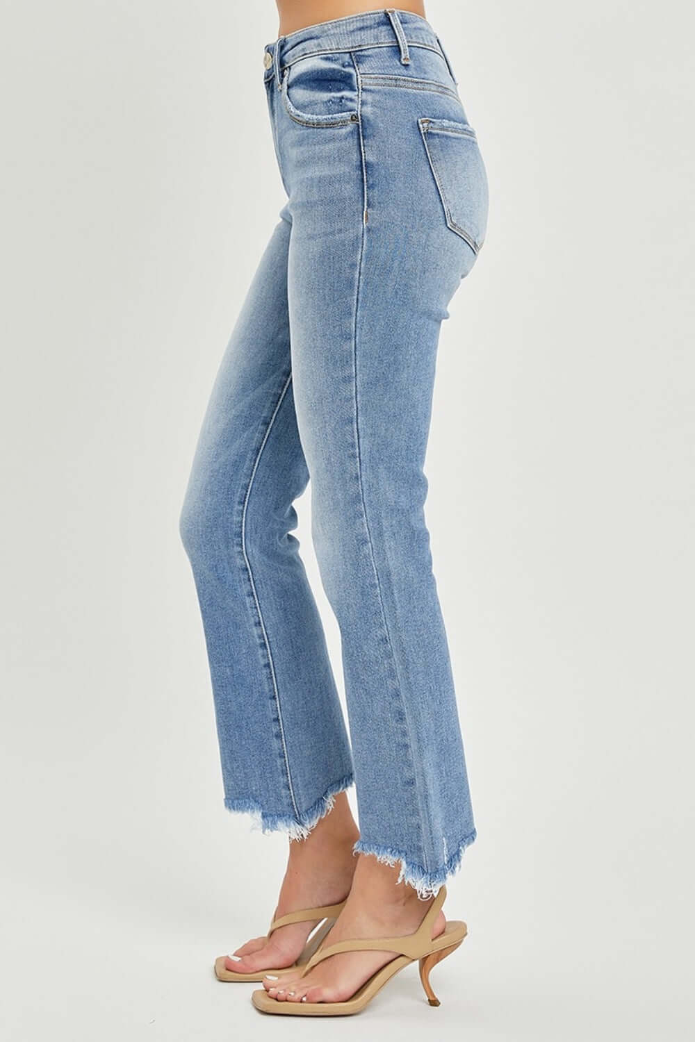 Frayed hem cropped straight Risen Jeans styled with heels for a chic casual look.