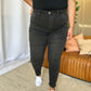 Woman wearing RFM Full Size High Rise Tummy Control Skinny Jeans with a sleek, figure-hugging fit and flattering high-waist design.