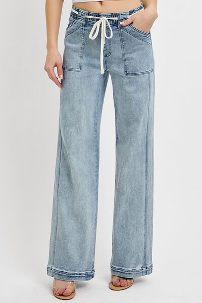 Light blue straight leg jeans with pockets, featuring a drawstring waist, perfect for casual or stylish looks.