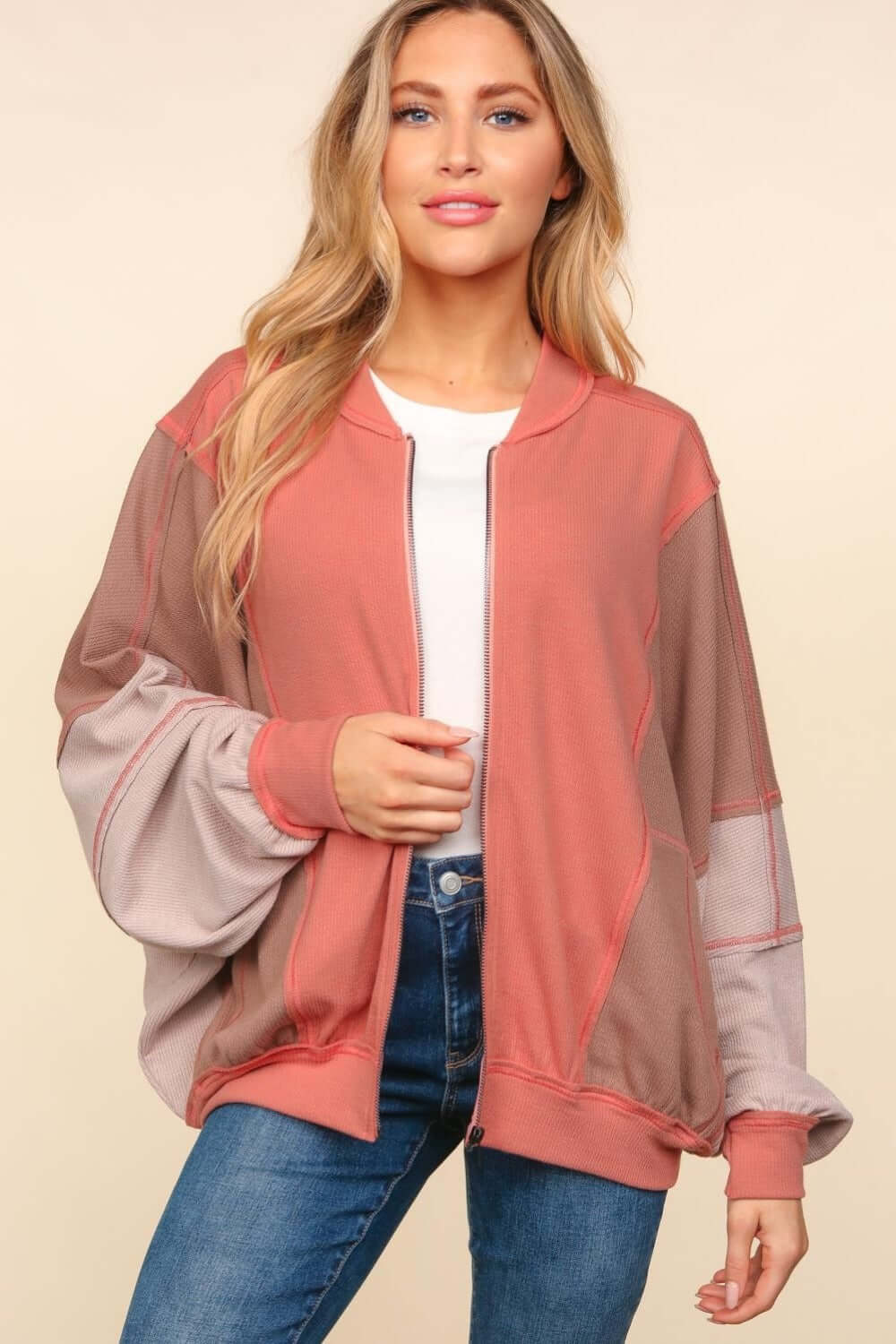 Trendy Haptics zip-up color block bomber jacket with stylish side pockets for casual layering.