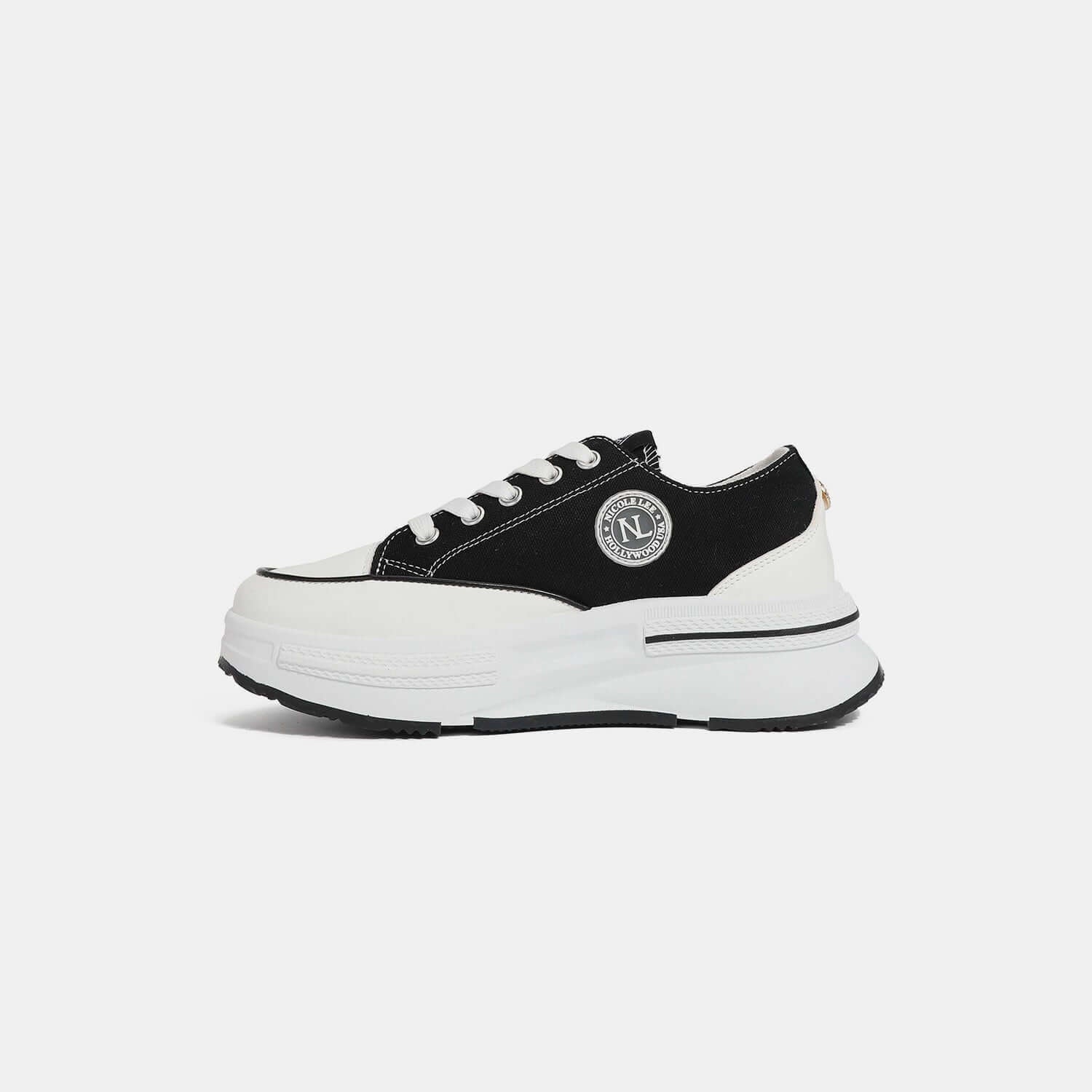 Nicole Lee USA black and white platform lace-up sneaker with logo emblem on the side.