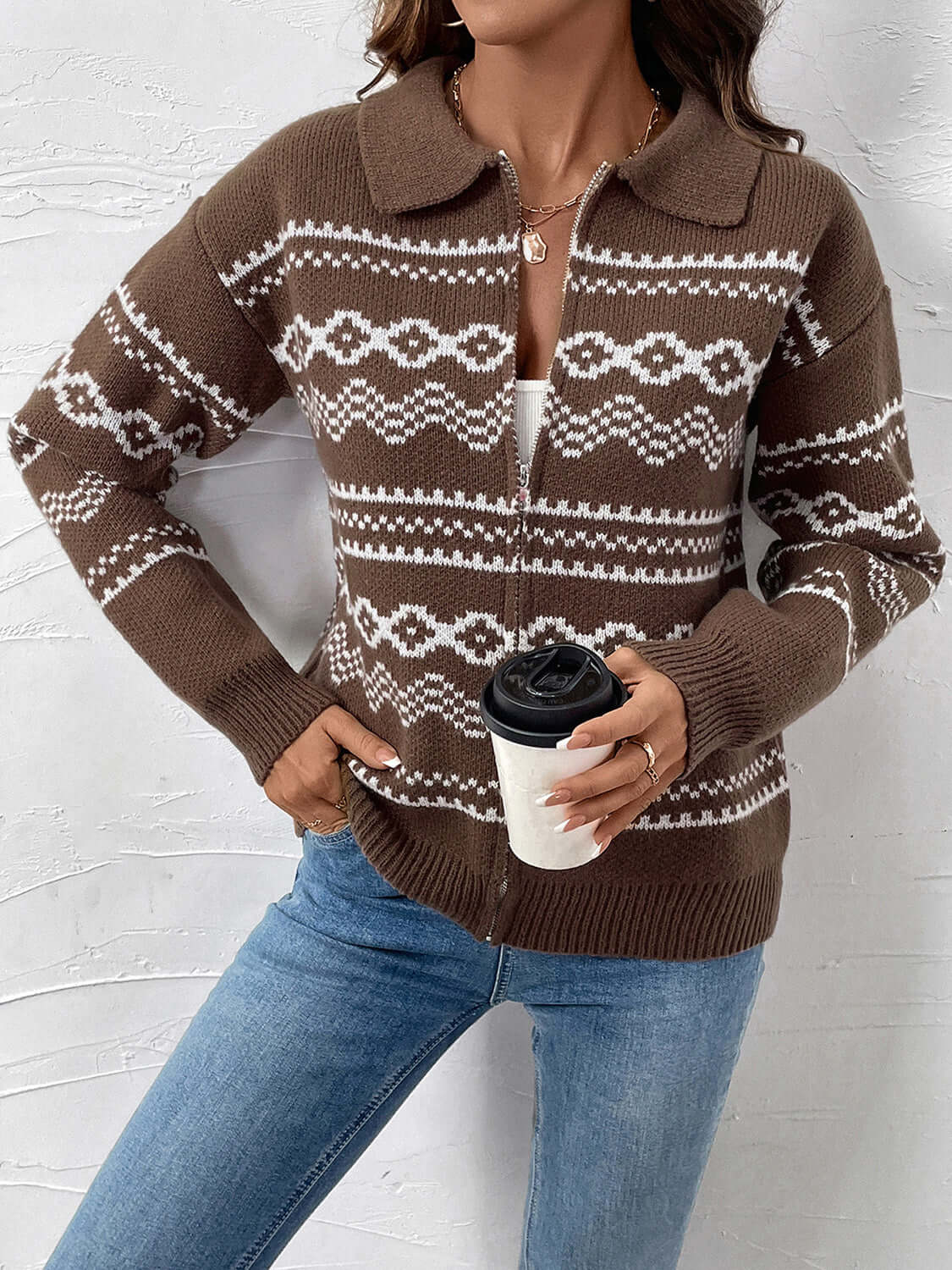 Woman wearing Perfee Geometric Zip Up Collared Neck Long Sleeve Cardigan, holding a coffee cup, showcasing the stylish brown geometric design.