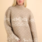 Festive beige sweater with snowflake pattern and mock neck, perfect for cozy winter gatherings and spreading holiday cheer