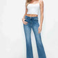 Model showcasing bytos Cat's Whiskers Mid Rise Bootcut Jeans with a white crop top and stylish heels against a plain background.